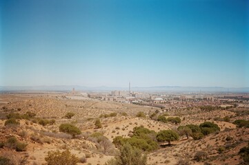 Distant perspective of the recently developed neighborhood with fields in the background