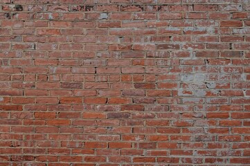Fototapeta premium Old-fashioned red brick interior wall for artistic backdrop