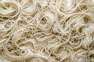 Raw spaghetti and macaroni pasta isolated on white background with pattern and texture