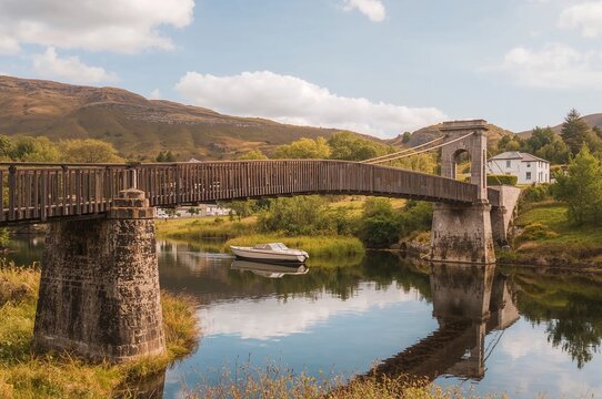 The timber hanging bridge crossing the Water of Ken in a small town in Scotland.