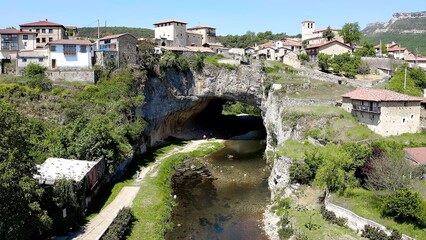 Aerial view of the town of Puentedei, province of Burgos, Spain. A place built on a huge stone tunnel through which the river passes.