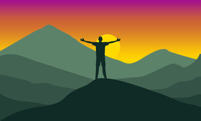 Man on the mountain peak with...