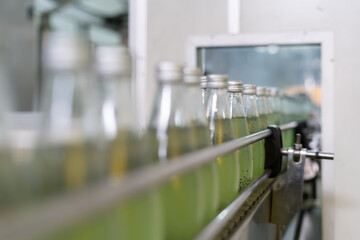 Factory of food or beverages, Conveyor for feed bottle, food or beverages on warehouse before send product to the customer. Quality control or assurance, Good standard