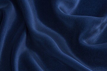 Obraz premium Luxurious velvet material with wavy satin and silk textures in an abstract fabric background