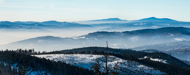 Moravskoslezske Beskydy mountains with highest Lysa hora hill in Czech republic from Barania Gora hill in Beskid Slaski mountains in Poland during winter