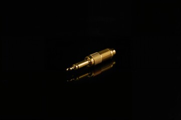6.3mm Gold-Plated Audio Jack for Headphones on Black Background
