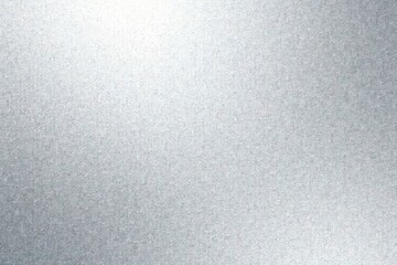 High-resolution image of a subtly textured metallic surface with a gradient of light