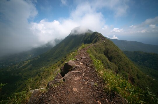 The challenging ascent to the peak of the roaring mountain with selective focus