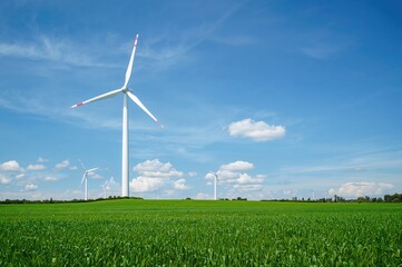 Wind turbine against a bright blue backdrop