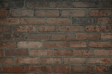 Naklejka premium Grungy backdrop featuring an aged brick surface