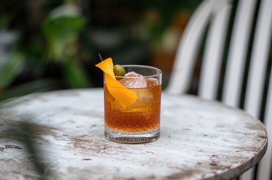 Vintage cocktail on a weathered surface. Focused view with blurred background.