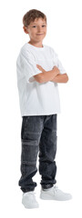 Cheerful boy in casual white t-shirt and jeans stands confidently with arms crossed, isolated on white background, concept of childhood and attitude © ImageFlow