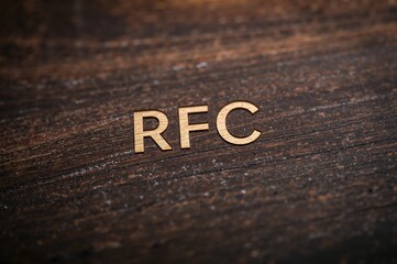 RFC Request for Comments text engraved on a wooden block