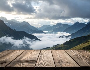 Wooden Table Top Overlooking Misty Mountain Range Under Cloudy Sky at Dawn
