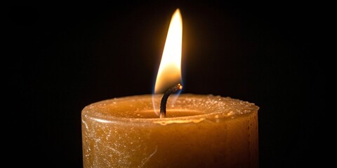 burning candle in the dark