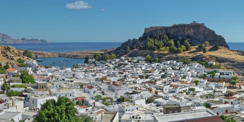 The picturesque town of Lindos with acropolis with white buildings near the coast, overlooked from the hill, Acropolis, Lindos, Rhodes, Island, Greece