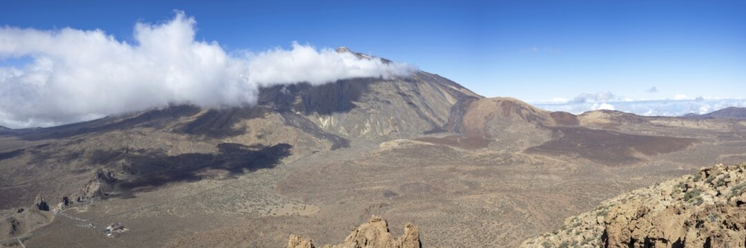 Panorama during the ascent to Alto de Guajara, 2715m, to the bizarrely shaped rock formations of volcanic rock, Roques de Garc&iacute;a, the visitor centre and the Hotel Parador, behind it the Pico del Teide, 3717m, Teide National Park, Parque Nacional del Teide, Tenerife, Canary Islands, Spain