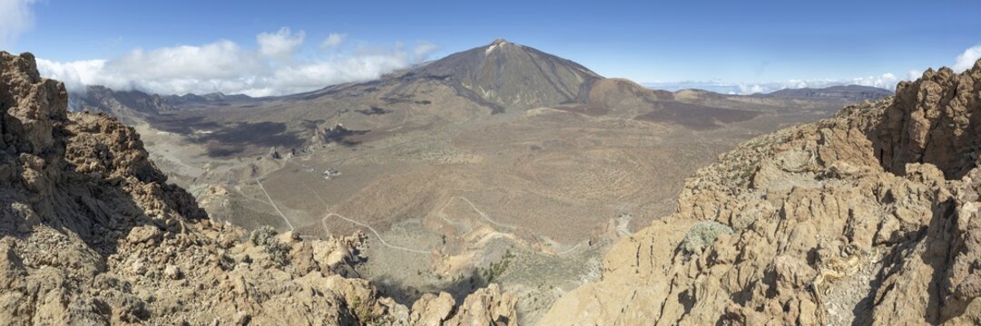 Panorama during the ascent to Alto de Guajara, 2715m, to the bizarrely shaped rock formations of volcanic rock, Roques de Garc&iacute;a, the visitor centre and the Hotel Parador, behind it the Pico del Teide, 3717m, Teide National Park, Parque Nacional del Teide, Tenerife, Canary Islands, Spain