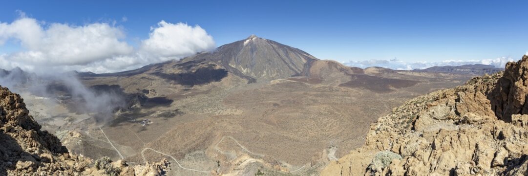 Panorama during the ascent to Alto de Guajara, 2715m, to the bizarrely shaped rock formations of volcanic rock, Roques de Garc&iacute;a, the visitor centre and the Hotel Parador, behind it the Pico del Teide, 3717m, Teide National Park, Parque Nacional del Teide, Tenerife, Canary Islands, Spain