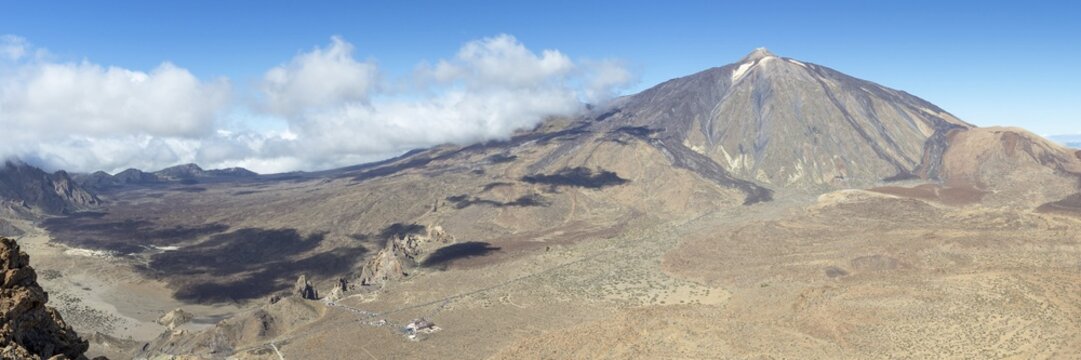 Panorama during the ascent to Alto de Guajara, 2715m, to the bizarrely shaped rock formations of volcanic rock, Roques de Garc&iacute;a, the visitor centre and the Hotel Parador, behind it the Pico del Teide, 3717m, Teide National Park, Parque Nacional del Teide, Tenerife, Canary Islands, Spain