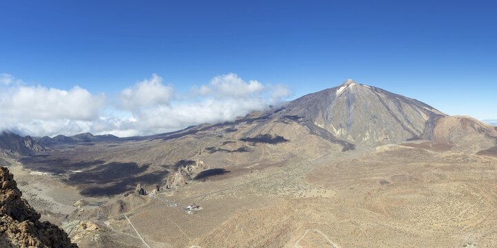Panorama during the ascent to Alto de Guajara, 2715m, to the bizarrely shaped rock formations of volcanic rock, Roques de Garc&iacute;a, the visitor centre and the Hotel Parador, behind it the Pico del Teide, 3717m, Teide National Park, Parque Nacional del Teide, Tenerife, Canary Islands, Spain