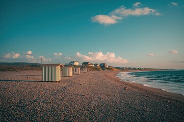 Vacant seaside changing rooms with striped patterns on the shore
