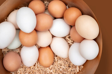 Chicken eggs in the nest. Eggs are one of the most nutritious and versatile foods in the world.