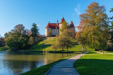 Obraz premium Historic castle and surrounding gardens in Central Europe