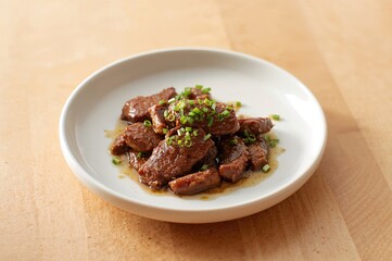 Saut&Atilde;&copy;ed chicken liver with chives served on a petite dish