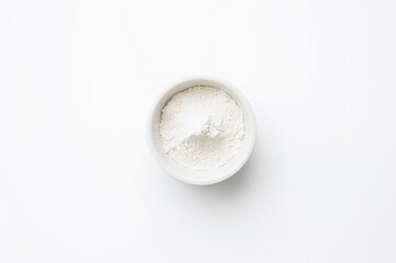 Powdered skimmed milk against a white backdrop