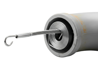 Plumbing drain snake with a coiled spring coming out of a pipe on a transparent background