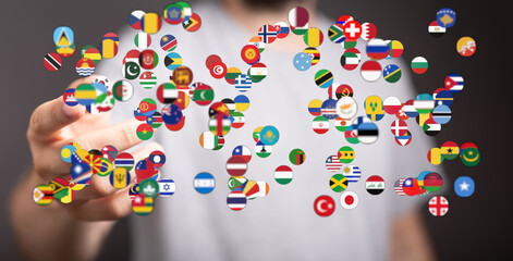 A hand interacts with floating circular flags symbolizing international collaboration and global connections. Represents world peace and coopera