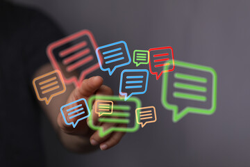 Digital messages floating over hand. Illustrates modern communication, technology and social media connections.