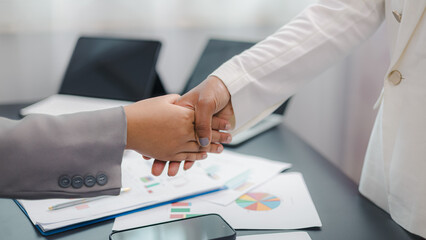 Business handshake agreement and partnership concept in modern office