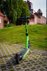 An abandoned rental bike on a sidewalk
