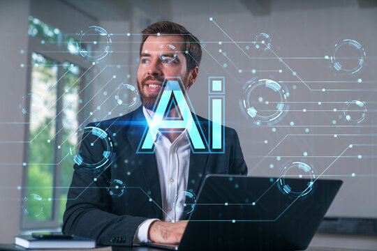 Businessman smiling while working on laptop with futuristic AI interface overlay in office environment, representing artificial intelligence concept.