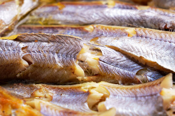 Texture of fried blue whiting fish. Macro shot. 