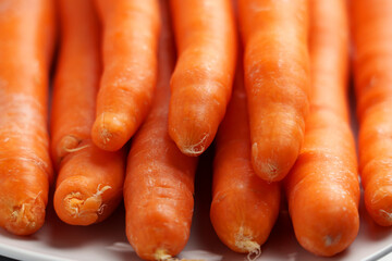 Organic fresh orange carrots. Whole nutritious dietary vegetables close-up