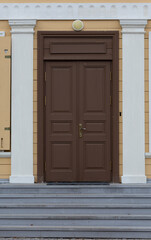 An Elegant Brown Door Featuring Timeless and Classic Architectural Elements, Design Details