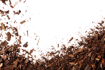 Dark brown wood chips scattered, black background