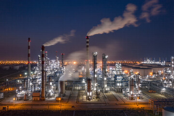 Ultra-detailed 8K night view of oil refinery plant with illuminated pipelines and rising smoke