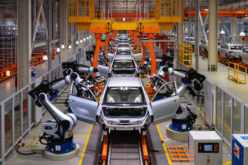 Ultra-realistic 8K wide shot of automated factory production line with robotic arms assembling car parts