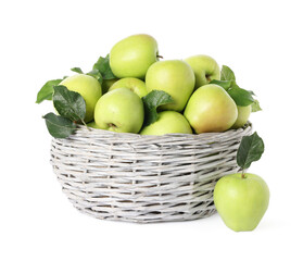Ripe green apples with fresh leaves in wicker basket isolated on white