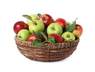 Fresh ripe apples with green leaves in wicker basket isolated on white