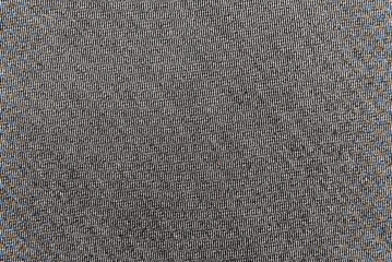 Texture of dense black fabric for tailoring. Canvas. Textile