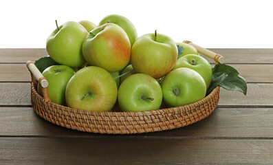 Fresh apples and green leaves on wooden table against white background