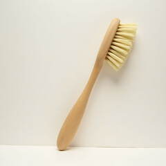 Wooden cleaning brush with natural bristles in minimalist style  