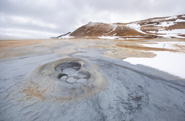 boiling mud pots on the colourful geothermal area, Námafjall, North Iceland