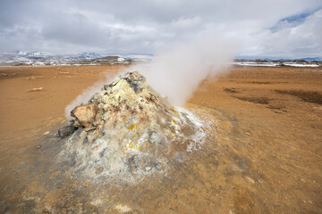 Fumaroles emitting hot volcanic steam and gases, Hverir geothermal area, North Iceland