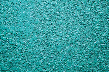 turquoise background. Abstract texture of plaster or wallpaper.